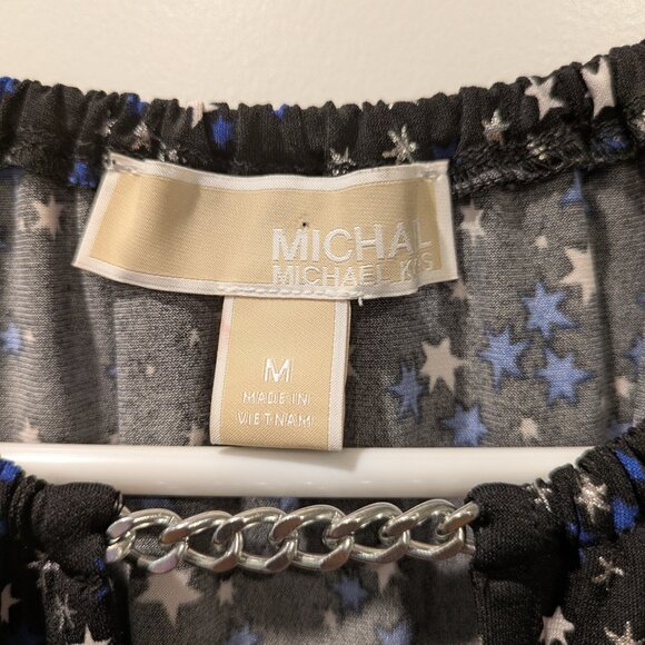 Michael Kors black top with white and blue star patterns and a silver chain on t - Picture 2 of 5